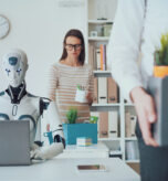 Dismissed business people packing their belongings and leaving the office, a robot is sitting at the desk and working: the impact of AI on jobs